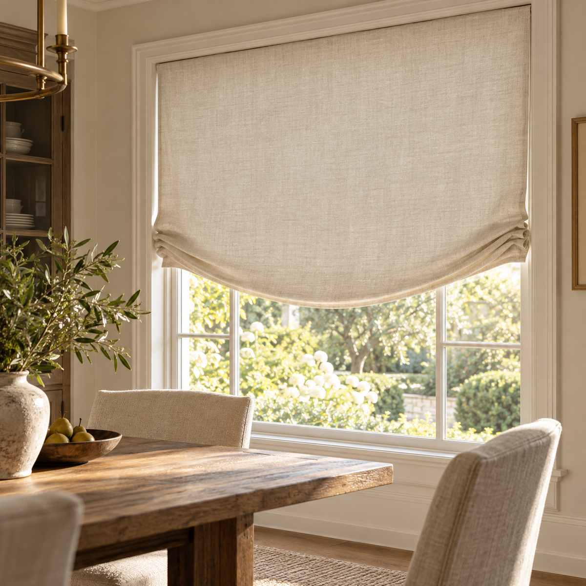 Relaxed Roman shade with a gently curved lower edge